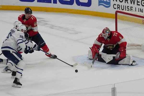 Florida Panthers goaltender Sergei Bobrovsky (72) deflects a shot ny Toronto Maple Leafs center Steven Lorentz (18) during the third period in Game 3 of a second-round NHL hockey playoff series, Friday, May 9, 2025, in Sunrise, Fla. (AP Photo/Marta Lavandier)
