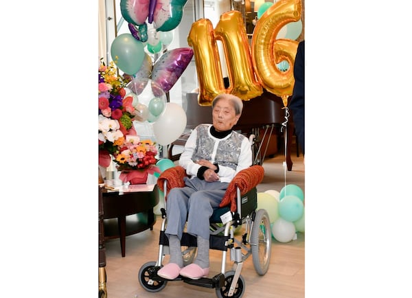 This photo provided by Ashiya City shows Tomiko Itooka, being celebrated for her 116th birthday at the nursing home she lives in Ashiya, western Japan, on May 23, 2024. (Ashiya City via AP)