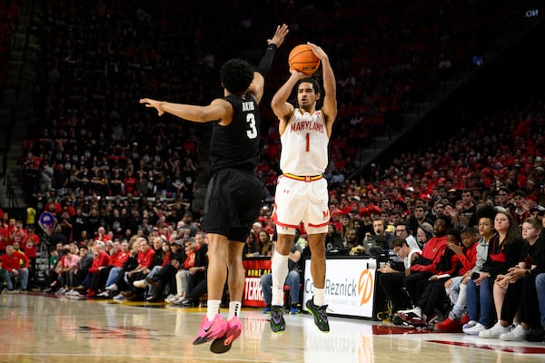 Maryland guard Rodney Rice (1) shoots against Michigan State guard Jaden Akins (3) during the second half of an NCAA college basketball game, Wednesday, Feb. 26, 2025, in College Park, Md. (AP Photo/Nick Wass)