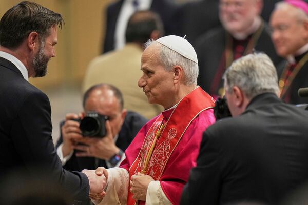 Pope Leo XIV meets Vice President JD Vance after the formal inauguration of his pontificate in St. Peter's Square, at the Vatican, Sunday, May 18, 2025. (AP Photo/Alessandra Tarantino)