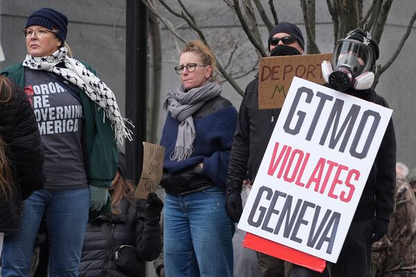 People protest outside the federal courthouse in Pittsburgh on Wednesday, Feb. 5, 2025. (AP Photo/Gene J. Puskar)