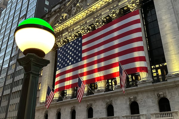 FILE - The American flags hangs on the facade of the New York Stock Exchange in New York's Financial District on Tuesday, Nov. 5, 2024. (AP Photo/Peter Morgan, File)