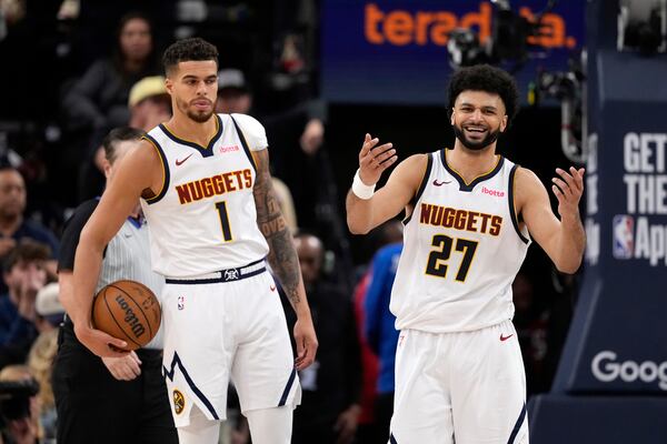 Denver Nuggets guard Jamal Murray, right, reacts after receiving a foul call against him as forward Michael Porter Jr. stands by during the second half in Game 6 of an NBA basketball first-round playoff series against the Los Angeles Clippers, Thursday, May 1, 2025, in Inglewood, Calif. (AP Photo/Mark J. Terrill)