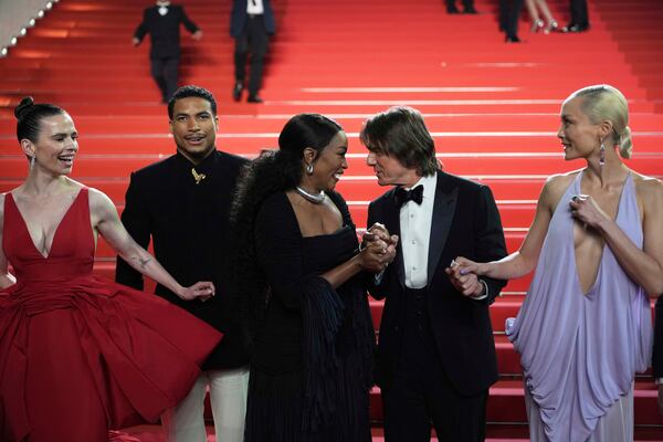 Hayley Atwell, from left, Greg Tarzan Davis, Angela Bassett, Tom Cruise, and Pom Klementieff pose for photographers upon departure from the premiere of the film 'Mission: Impossible – The Final Reckoning' at the 78th international film festival, Cannes, southern France, Wednesday, May 14, 2025. (AP Photo/Natacha Pisarenko)