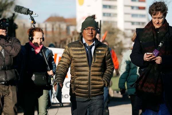 Peruvian farmer Luciano Lliuya arrives at the Higher Regional Court in Hamm, Germany, for a first hearing of his climate damages case against the German energy company RWE for its carbon emissions, which may have been contributing to the melting of a nearby glacier that could flood his home, Monday, March 17, 2025. (AP Photo/Martin Meissner)