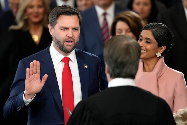 JD Vance is sworn in as vice president by Supreme Court Justice Brett Kavanaugh as Usha Vance holds the Bible during the 60th Presidential Inauguration in the Rotunda of the U.S. Capitol in Washington, Monday, Jan. 20, 2025. (AP Photo/Julia Demaree Nikhinson, Pool)