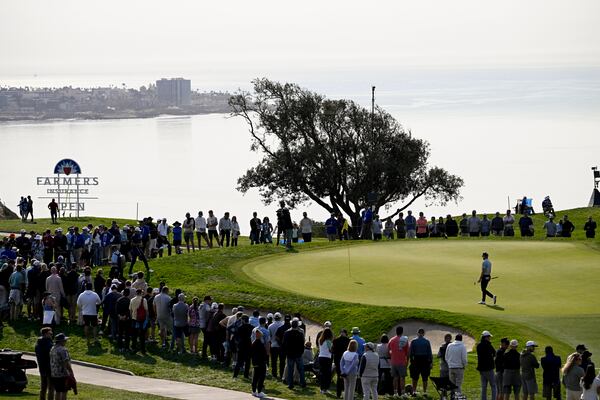 Danny Walker walks on the fifth hole green on the South Course at Torrey Pines during the third round of the Farmers Insurance Open golf tournament Friday, Jan. 24, 2025, in San Diego. (AP Photo/Denis Poroy)