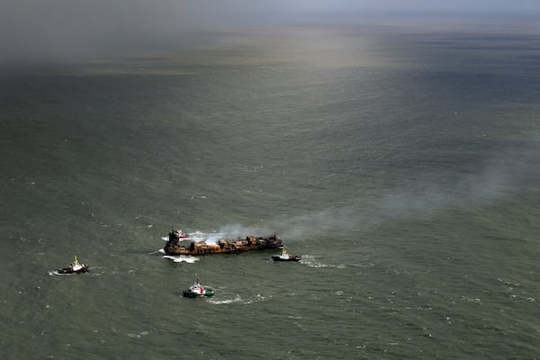 Smoke billows from the MV Solong cargo ship in the North Sea, off the Yorkshire coast, Tuesday, March 11, 2025, in England. (Dan Kitwood/Pool Photo via AP)