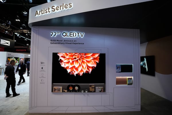 A 77'' OLED TV is pictured at a LG Electronics booth during the CES tech show Tuesday, Jan. 7, 2025, in Las Vegas. (AP Photo/Abbie Parr)