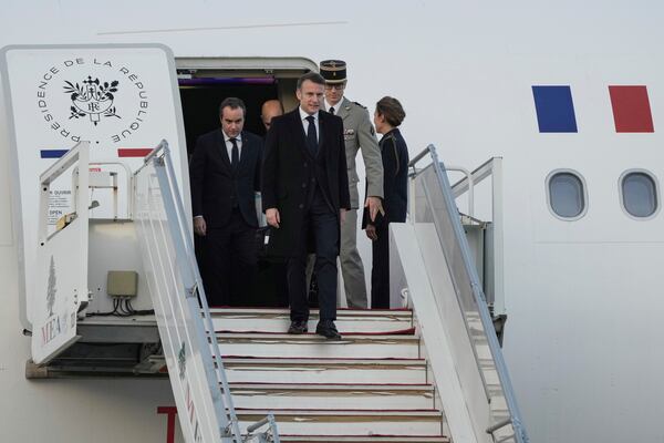 French President Emmanuel Macron gets off from his plane as he arrives at Beirut's Rafik Hariri International Airport in Beirut, Lebanon, Friday, Jan. 17, 2025. (AP Photo/Hassan Ammar)