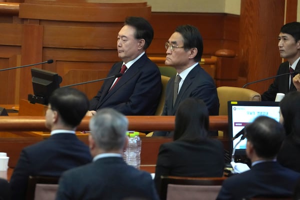 FILE - South Korea's impeached President Yoon Suk Yeol, top left, attends a hearing of his impeachment trial at the Constitutional Court in Seoul, South Korea, on Feb. 11, 2025. (AP Photo/Lee Jin-man, Pool, File)