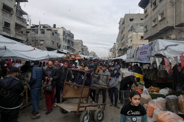 Palestinians shop at Sheikh Radwan Market, west of Gaza City, before the Iftar, the fast-breaking meal, during the holy month of Ramadan on Monday, March 3, 2025. (AP Photo/Jehad Alshrafi)