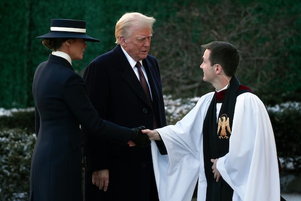 President-elect Donald Trump and his wife Melania are greeted as they arrive for church service at St. John's Episcopal Church across from the White House in Washington, Monday, Jan. 20, 2025, on Donald Trump's inauguration day. (AP Photo/Matt Rourke)