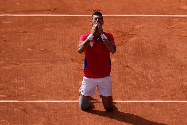 FILE - Serbia's Novak Djokovic blows a kiss after defeating Spain's Carlos Alcaraz in the men's singles tennis final at the Roland Garros stadium during the 2024 Summer Olympics, Sunday, Aug. 4, 2024, in Paris, France. (AP Photo/Andy Wong, File)