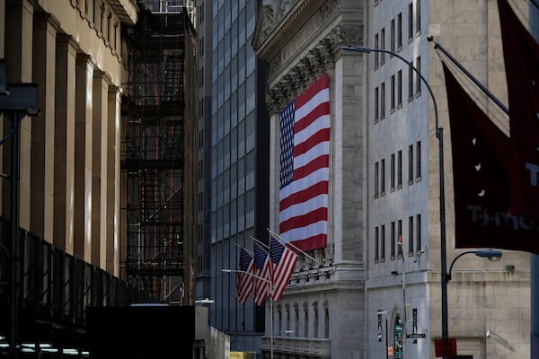 An American flag is displayed on the outside of the New York Stock Exchange in New York, Wednesday, Feb. 26, 2025. (AP Photo/Seth Wenig)