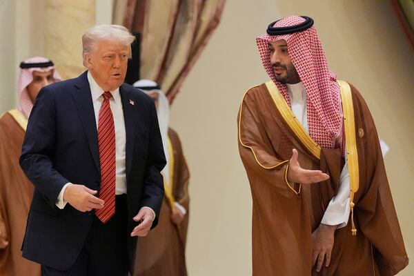 President Donald Trump arrives with Saudi Crown Prince Mohammed bin Salman for the group photo with Gulf Cooperation Council leaders during the GCC Summit in Riyadh, Saudi Arabia, Wednesday, May 14, 2025. (AP Photo/Alex Brandon)