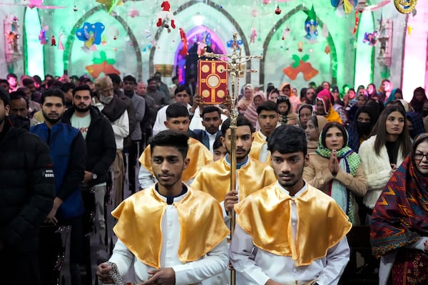 Pakistani Christians attend midnight Christmas Mass at St. Anthony's church in Lahore, Pakistan, Wednesday, Dec. 25, 2024. (AP Photo/K.M. Chaudary)