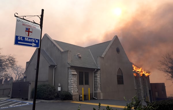 Flames rise out of St. Mark's Episcopal Church, Wednesday, Jan. 8, 2025, in the downtown Altadena section of Pasadena, Calif. (AP Photo/Chris Pizzello)