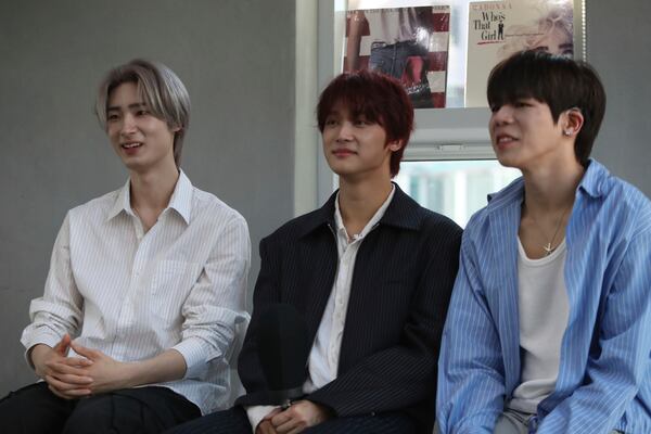 Members of K-pop band Big Ocean, from left to right, Jiseok, PJ and Chanyeon, participate in an interview with The Associated Press in Seoul, South Korea, April 15, 2025. (AP Photo/Juwon Park)
