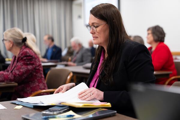 Oregon state Sen. Sara Gelser looks through papers during a special session of the Oregon legislature on Thursday, Dec. 12, 2024, in Salem, Ore. (AP Photo/Jenny Kane)