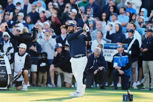 J.J. Spaun watches his hit from the 17th tee during a playoff round of The Players Championship golf tournament Monday, March 17, 2025, in Ponte Vedra Beach, Fla. (AP Photo/Chris O'Meara)