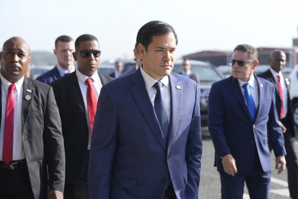 Secretary of State Marco Rubio, with Frank Alexis Abrego, Panama's Minister of Public Security, right, arrives to watch people board a repatriation flight bound for Colombia at Albrook Airport in Panama City, Monday, Feb. 3, 2025. (AP Photo/Mark Schiefelbein, Pool)