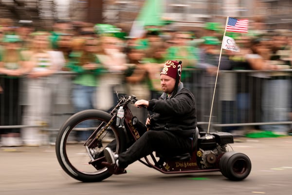 A Shriner motors by the crowd during the St. Patrick's Day parade, Sunday, March 16, 2025, in Boston, Mass. (AP Photo/Robert F. Bukaty)