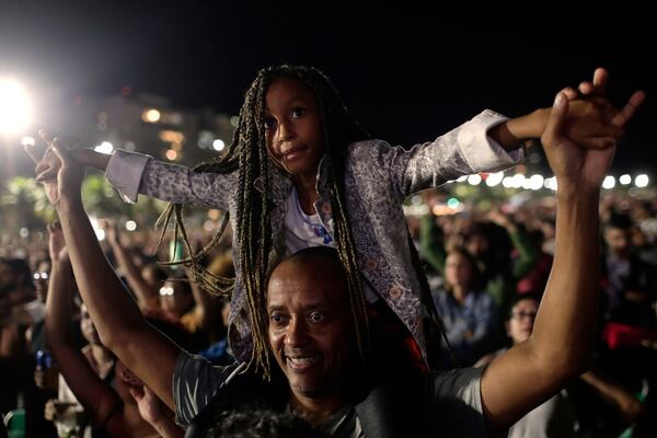 Fans cheer as they watch Lady Gaga free concert on Copacabana beach, in Rio de Janeiro, Saturday, May 3, 2025. (AP Photo/Bruna Prado)