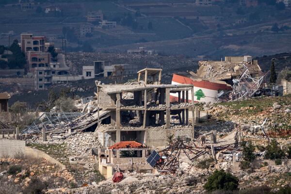 Destroyed buildings in an area of the village of Mays al-Jabal in southern Lebanon, located next to the Israeli-Lebanese border, as seen from northern Israel, Sunday, Jan.26, 2025. (AP Photo/Ariel Schalit)