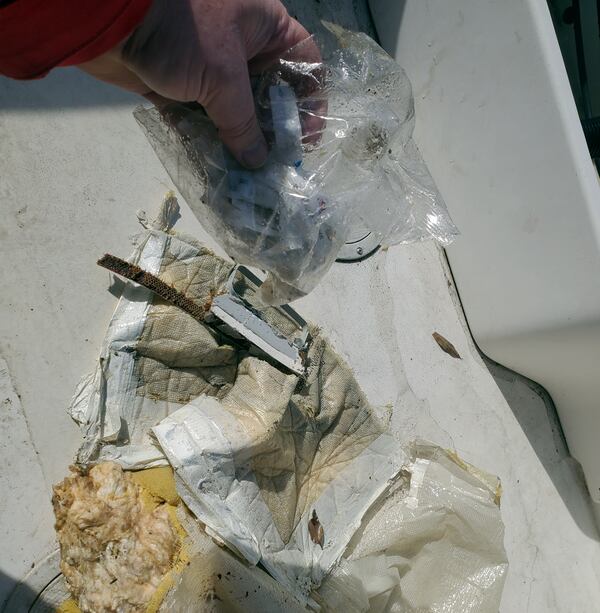 This image provided by Dean Naujoks shows debris recovered from the Potomac River south of Ronald Reagan Washington National Airport in Alexandria, Va., Thursday, Jan. 30, 2025. (Dean Naujoks via AP)