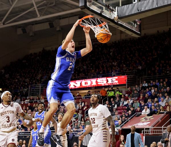 Duke guard Cooper Flagg (2) dunks the ball during the first half of an NCAA college basketball game against Boston College, Saturday, Jan. 18, 2025, in Boston. (AP Photo/Mark Stockwell)