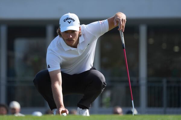 Rasmus Højgaard, of Denmark, lines up a putt at the second hole during the third round of the Phoenix Open golf tournament at TPC Scottsdale Saturday, Feb. 8, 2025, in Scottsdale, Ariz. (AP Photo/Ross D. Franklin)