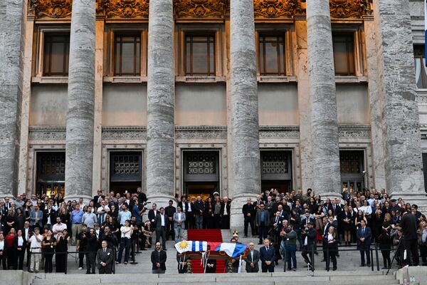 The casket of late former President Jose Mujica stands outside the Legislative Palace after funeral ceremonies in Montevideo, Uruguay, Thursday, May 15, 2025. (AP Photo/Santiago Mazzarovich)
