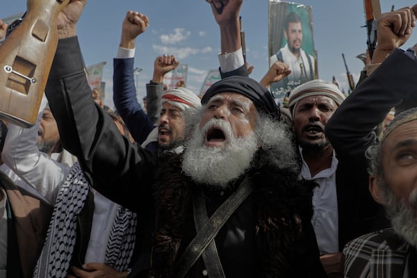 Houthi supporters chant slogans and hold pictures of Abdul Malik al-Houthi, the leader of the Houthi movement, during an anti-U.S. and anti-Israel rally in Sanaa, Yemen, Monday, March 17, 2025. (AP Photo/Osamah Abdulrahman)