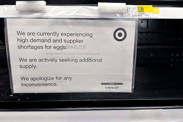 A sign is mounted on a shelve of eggs at a grocery store in Chicago, Saturday, Feb. 8, 2025. (AP Photo/Nam Y. Huh)