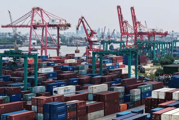 Machines loading container at a container terminal, in Shanghai, China on Wednesday, May 14, 2025. (Chinatopix Via AP)