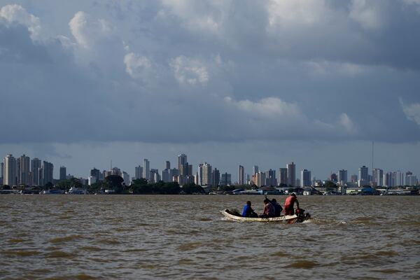 FILE - A boat sails on the bay of the Guama River with Belem, Brazil, in the background, Aug. 6, 2023. (AP Photo/Eraldo Peres)