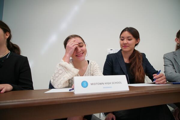 Midtown High School Ethics Bowl teammates Lizzie Lyman, left, and Sloane Crisler prepare for the quarterfinal round at the National High School Ethics Bowl in Chapel Hill, N.C., on Sunday, April 13, 2025. (AP Photo/Allen G. Breed)