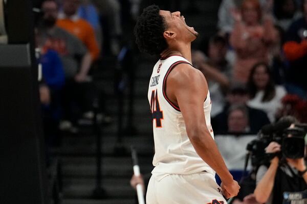 Auburn center Dylan Cardwell (44) celebrates scoring during the first half in the second round of the NCAA college basketball tournament, Saturday, March 22, 2025, in Lexington, Ky. (AP Photo/Brynn Anderson)