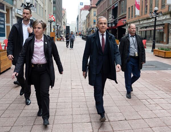 Prime Minister Mark Carney walks to his first news conference after winning the federal election, in Ottawa, Friday, May 2, 2025. (Adrian Wyld/The Canadian Press via AP)