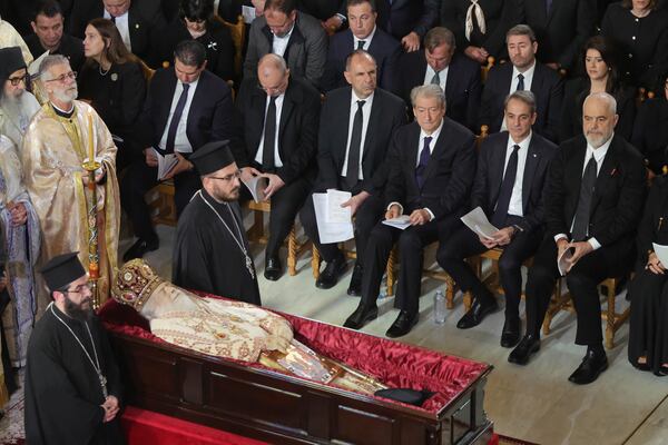 Albania's Prime Minister Edi Rama, right, and his Greek counterpart Kyriakos Mitsotakis, second right, attend the funeral of the late Archbishop Anastasios of Tirana, Durres and All Albania, inside the Cathedral of the Resurrection of Christ, in Tirana, Albania, Thursday, Jan. 30, 2025. (AP Photo/Vlasov Sulaj)