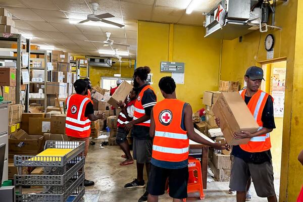 In this image released by Vanuatu Red Cross Society, its volunteers assist staff with the clean up at Vila Central Hospital in Port Vila, Vanuatu Wednesday, Dec. 18, 2024, following a powerful earthquake that struck just off the coast of Vanuatu in the South Pacific Ocean. (Vanuatu Red Cross Society via AP)