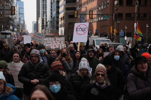 Protesters demonstrate against Project 2025, in Philadelphia, Wednesday, Feb. 5, 2025. (AP Photo/Matt Rourke)