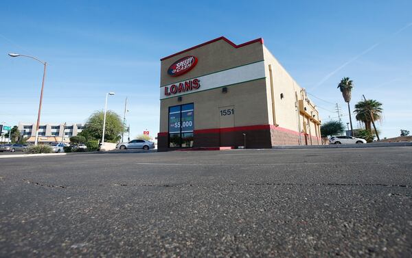 FILE - A sparse parking lot is seen Jan. 18, 2018, in Phoenix, where police say a double homicide previously took place that is linked to Cleophus Cooksey. The double homicide at the location took place on Monday, Nov. 27, 2017. (AP Photo/Ross D. Franklin, File)