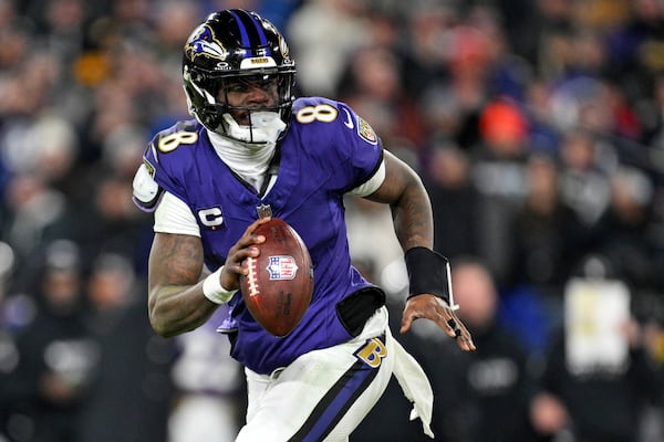 FILE - Baltimore Ravens quarterback Lamar Jackson (8) looks to pass during the second half of an NFL wild card playoff football game against the Pittsburgh Steelers, Saturday, Jan. 11, 2025, in Baltimore. (AP Photo/Terrance Williams, File)