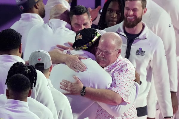 Kansas City Chiefs coach Andy Reid, right, hugs Philadelphia Eagles' Brandon Graham during Super Bowl 59 Opening Night, Monday, Feb. 3, 2025, in New Orleans, ahead of the NFL football game between the Philadelphia Eagles and the Kansas City Chiefs Sunday. (AP Photo/Godofredo A. Vásquez)