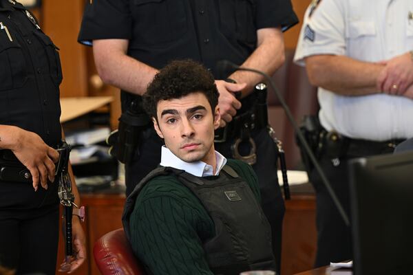 FILE - Luigi Mangione, accused of fatally shooting Brian Thompson, the CEO of UnitedHealthcare, appears in Manhattan state court in New York, Friday, Feb. 21, 2025. (Curtis Means/Pool Photo via AP, File