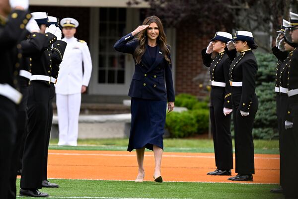 Homeland Security Secretary Kristi Noem salutes as she arrives at the commencement for the United States Coast Guard Academy, Wednesday, May 21, 2025 in New London, Conn. (AP Photo/Jessica Hill)