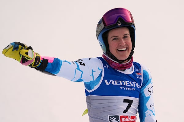 United States' Paula Moltzan celebrates at the finish area of a women's giant slalom, at the Alpine Ski World Championships, in Saalbach-Hinterglemm, Austria, Thursday, Feb. 13, 2025. (AP Photo/Giovanni Auletta)