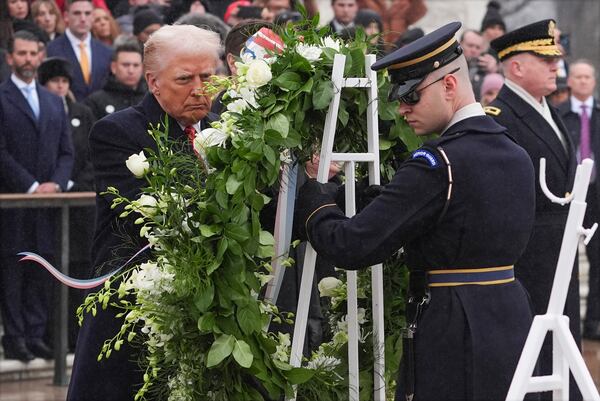 President-elect Donald Trump participates in a wreath laying ceremony at the Tomb of the Unknown Soldier at Arlington National Cemetery, Sunday, Jan. 19, 2025, in Arlington, Va. (AP Photo/Evan Vucci)